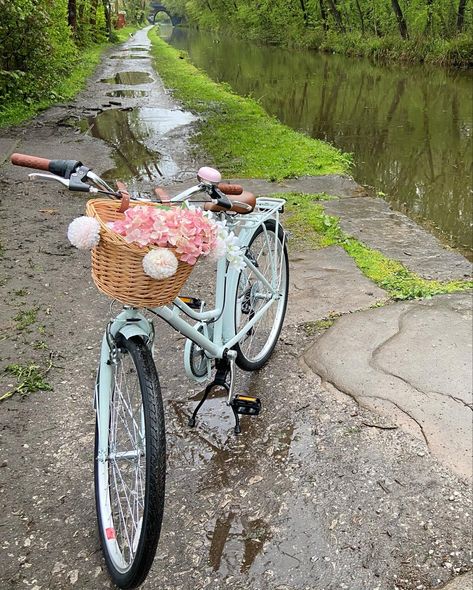 Vintage style bike with wicker basket on the front. Pink bell. Pale blue bike with pink flowers in the basket. Set by the canal. Bike Vintage Aesthetic, Cute Bikes With Basket, Vintage Bicycles Aesthetic, Bikes With Baskets, Bike With Basket Aesthetic, Vintage Bikes With Basket, Aesthetic Bikes, Cycle Aesthetic, Pretty Bicycle