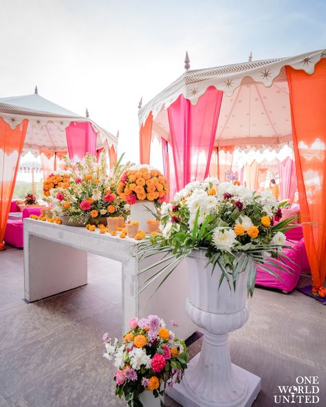 Bringing alive a festive reverence with shades of tangerine and fuschia fused together on a sunny afternoon. 📞 097995 35809 📩 oneworldunitedoffice@gmail.com #wedding #weddingdecor #eventmanagement #decor #indianweddings #florals #eventdecor #weddingday #mehndifunction #mehendiceremony #mehendidecor #vibrantmehendidecor #floralarrangement #floaldecor #mehendievent #eventplanner #mehendisetup Mehndi Function, Marriage Decoration, Easy Backdrops, Sunny Afternoon, Venue Decor, Wedding Mood Board, Pink Decor, Wedding Mood, Seating Arrangements