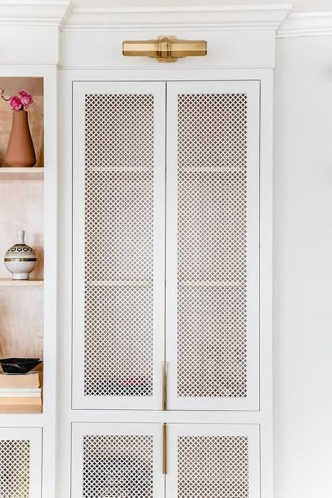 White quatrefoil metal cabinet doors illuminated by brass picture lights beside white built-in cabinets. White Shaker Kitchen, Casa Vintage, Kitchen Design Trends, Metal Cabinet, Transitional Living Rooms, Built In Cabinets, Mud Room, Cabinet Design, Built Ins