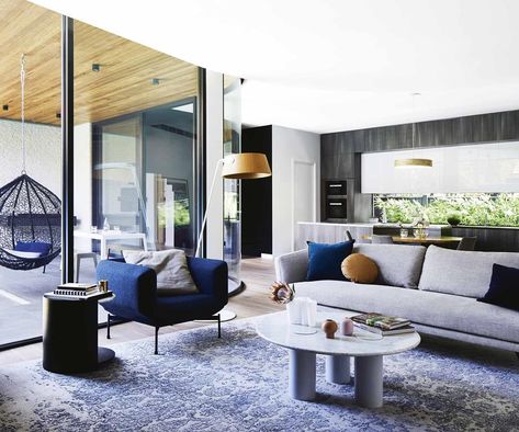 Shannon Vos of Vos Creative, tackles that modern dilemma: how to get combined spaces right. Here are his top tips for open-plan layouts. Timber Dining Table, Modern Extension, Cosy Room, Open Plan Living Room, Cosy Living Room, Lighting Design Interior, Gorgeous Kitchens, Decor Buy, Australian Homes