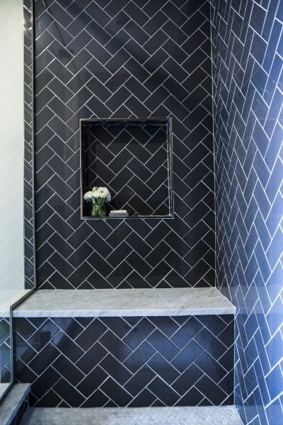 Contemporary shower features navy herringbone tiles accented with a navy tiled niche over a carrera marble shower bench. Subway Tile Shower Designs, Colors Bedroom, Subway Tile Showers, Contemporary Shower, Bad Inspiration, Bedroom Remodel, Shower Niche, Herringbone Tile, Bathroom Shower Tile