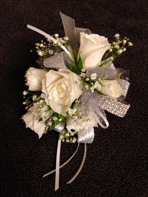 Wristlet corsage using a rhinestone wristlet. White spray roses and babies breath with silver and white ribbon and tulle accents. Floral design by Barbara Colson Wedding Coursage, Flowers At Wedding, Wristlet Corsage, Boutonniere Ideas, Prom Flowers Corsage, White Corsage, Prom Corsages, Prom Bouquet, Wrist Corsage Prom