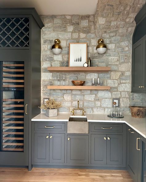 Check out the bar station we built at our Stonehaven spec. The concrete farm sink, the stone backsplash, and the floating white oak shelves create an eclectic combination that comes together beautifully ✨. #homeinspo #interiors #luxuryhomes #luxury #interiordesigner #nashvillehomes #nashvillecontractors #nashvilleconstruction #nashvillelistings #nashvillerealestate #nashvillerealtor #nashvillehomesforsale #luxurylisting #realestate #newconstruction #buildersofig #buildersofinsta #moderninter... Bar With Stone Backsplash, White Oak Shelves, Wooden Kitchen Storage, Backsplash With Dark Cabinets, Stone Backsplash Kitchen, Nashville Real Estate, Wood Bar Cart, Bar Station, Limestone Wall