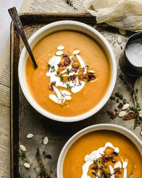 This delicious, healthy butternut squash soup recipe features a rich & creamy blend of roasted squash, garlic, chicken broth, & coconut milk. Topped with crispy chopped bacon and cilantro pumpkin seeds, this beautiful soup bursts with flavor in every bite. Paleo, Gluten-Free, Dairy Free, and Whole30. #butternutsquashsoup #souprecipes #dairyfree #paleo #soup #vitamixrecipes Butternut Squash Soup Vitamix, Paleo Butternut Squash Soup, Healthy Butternut Squash Soup, Healthy Butternut Squash, Butternut Squash Soup Recipe, Winter Soup Recipe, Freezer Recipes, Butternut Squash Recipes Soup, Squash Soup Recipe