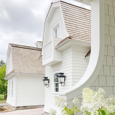 Su Casa Design on Instagram: "This project is freshly painted and waiting on landscaping. I know how important landscaping is to a project, but I’d say this place looks pretty good even without it! 😜 #dreamhome #sucasadesign #sucasa #housedesign . . . #whitehouse #hamptons #shingles #gambrel #hydrangea #porch #lighting #sconces #cedar #roof #design #designer #residential #construction #intheworks #balcony #classic #timeless #house #home #traditional" Heat Blanket, Colonial Garden, Colonial House Exteriors, Kitchens Cabinets, Cedar Roof, Ready To Receive, Hampton House, Cedar Shingles, Home Board