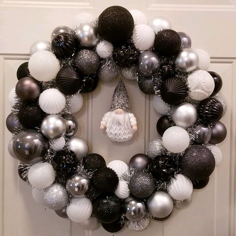 Name: Winter Gnome Colors: Black/Silver/Pewter/White This beautiful wreath is made from shatterproof ornaments. 50% of the profits from each wreath sale goes to Auburn Valley Humane Society.  I do this because I enjoy it and it raises funds for my favorite local charity.  It also gives you something beautiful to display in your home. *each wreath is unique so materials might be slightly different from wreath to wreath. Black And White Christmas Wreath Ideas, Black And White Christmas Wreaths For Front Door, Black And White Knombs Wreath, Black Front Door Wreaths & Garlands, Christmas Wreath Black Whote Gold, Black Christmas Decorations, Shatterproof Ornaments, Holiday Deco, Black Christmas Trees