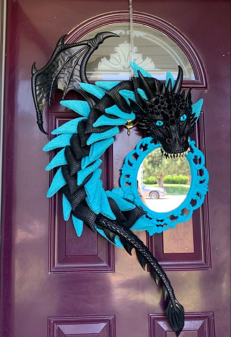 Blue and black poly burlap dragon with blue mirror wreath Dragon Mirror, Dragon Wreath, Mirror Wreath, Mermaid Crafts, Dragon Crafts, Halloween Door Decorations, Blue Mirror, Diy Dollar Store Crafts, Seasonal Wreaths