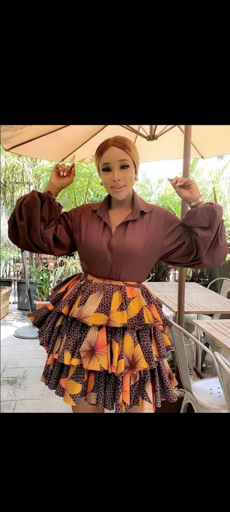 A three step short Ankara skirt with a shirt Ankara Short Skirt And Blouse, Ankara Flare Skirt, Flare Ankara Dress, Ankara Short Skirt, Layered Skirt Outfit, Skirt And Top Outfits, Ankara Skirt And Blouse Styles, Ankara Dress Designs, African Print Maxi Skirt