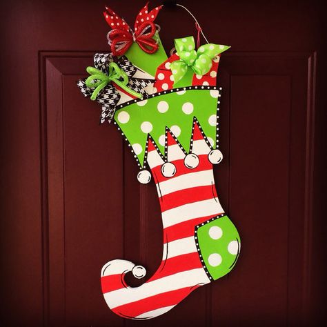 Wooden Christmas Stocking Door Hangers, Painted Stockings Ideas, Painting Stocking Ideas, Wooden Christmas Stocking, Christmas Wreath Door, Striped Christmas Stocking, Cow Craft, Decorated Stockings, Mosaic Art Diy