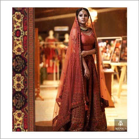 Embellished with gleaming sequins, cut beads and contrast zari border, this brick-red lehenga by @seemattiofficial resembles a regal look, to make your special occasions truly magical! Brick Red Lehenga, Onam Sarees, Muslim Bridal Dress, Saree Kerala, Muslim Wedding Photos, Hijabi Brides, Muslim Wedding Photography, Muslim Wedding Dresses, Kerala Saree