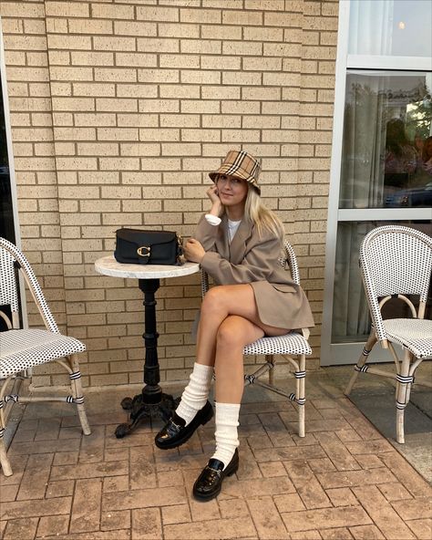 Black loafers with a Burberry bucket hat and tan blazer Burberry Bucket Hat Outfit Women, Tan Bucket Hat Outfit, Burberry Hat Outfit, Burberry Bucket Hat Outfit, Dior Bucket Hat Outfit, Kuwait Outfits, Burberry Bag Outfit, Loafers Women Outfit, Designer Wishlist