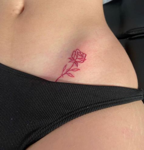 Small Pelvic Tattoos Women, Rose Stomach Tattoo, Red Ink Rose Tattoo, Red Hip Tattoo, Rose Hip Tattoo, Pelvic Tattoo Hip, Pelvic Tattoo, Rose Tattoo On Hip, Pelvic Tattoos