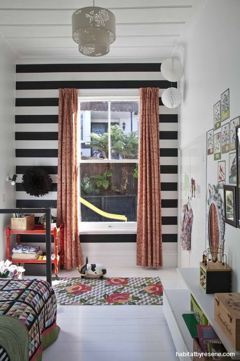 Talia used a broad striped Resene Black & White wallpaper as a feature wall in daughter Sabien’s room. Photographed by Emily Hlavac Green for Homestyle magazine. Striped Wallpaper Nursery, Black And White Striped Wallpaper, Striped Walls Horizontal, Black And White Striped Wall, Black And White Stripe Wallpaper, Ancient Wallpaper, Chris Taylor, Black Feature Wall, Renovated Kitchen