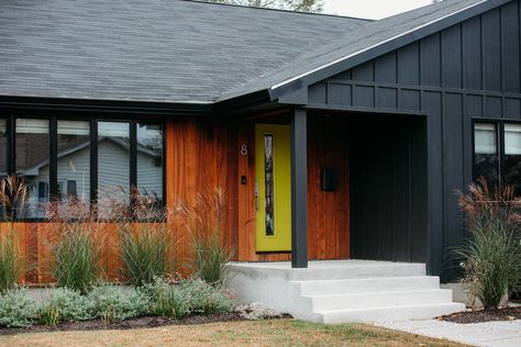 Looking for mid-century modern house exterior design inspo? In this renovation, Dwell October transformed a neglected ranch house by adding black board and batten fiber cement siding, warm sapele wood accents, and a chartreuse front door. Read on for sources and more details. Chartreuse Front Door, Black Board And Batten, 1970s House Renovation, Mid Century Modern House Exterior, Charred Wood Siding, Cement Steps, Modern Mobile Homes, Cedar Shake Siding, 1970s House