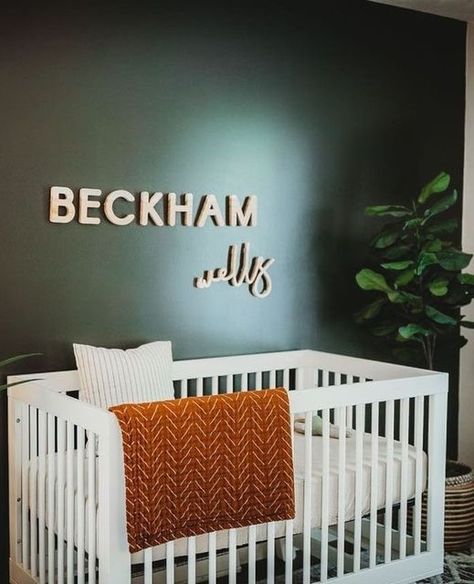 Sarah | Nursery Signs, Nursery Design & Nursery Decor on Instagram: "A show-stopping feature wall in a dark green compliments the hickory capital and script natural textures. The rust blanket, with its dramatic striped pattern, helps to ground the bold green hue in this nursery.⁠ ⁠ Nursery Design by @mrshood0912⁠ ⁠ Holiday Closure Reminder: We will be taking holidays to spend time with our family this season. The shop will be open for orders however, all orders placed between December 16-January Sage Green And Rust Nursery, Emerald Green Nursery Gender Neutral, Green And Burnt Orange Nursery, Green And Rust Nursery, Rust Blanket, Orange Nursery Boy, Boys Bedroom Green, Green Nursery Boy, Nursery Inspiration Boy