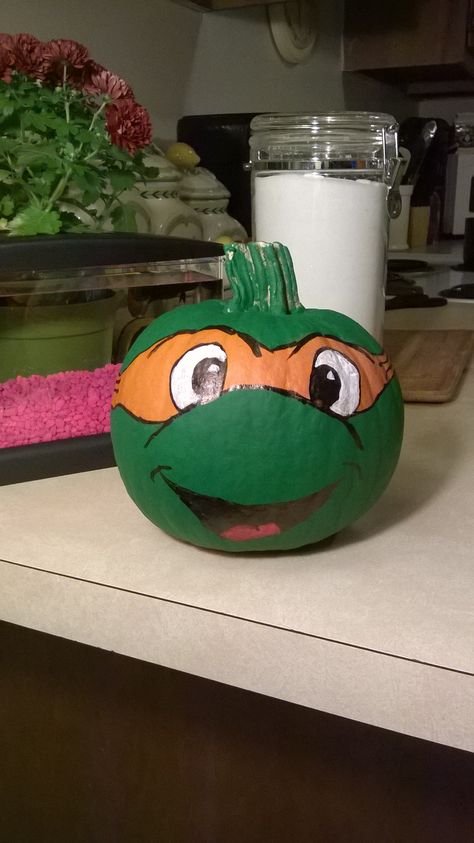 My son's first Halloween pumpkin. Ninja Turtle Pumpkin Painting Ideas Ninja Turtle, Tmnt Pumpkin Painting, Ninja Turtle Pumpkin Painting, Tmnt Pumpkin, First Halloween Pumpkin, Turtle Pumpkin, Book Character Pumpkins, Ninja Turtle Pumpkin, Pumpkin Paintings