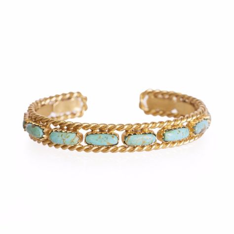 Our Cable Bangle is a great piece to add to your bracelet collection. The bangle is 18K gold plating over hypoallergenic and nickel free brass and features a chain texture with turquoise stones running along the center. You can stack this bangle with other bracelets or simply wear it alone. Details: TYPEBracelet COLLECTIONWestern Contemporary SIZEABLEYes SIZEFits most wrists. Squeeze or stretch the bangle to fit for comfort STONETurquoise PearlBlack OnyxLapisLabradorite METAL TYPE18K gold platin Natural Turquoise Stone, Gold Cuffs, Turquoise Stones, Western Jewelry, Bracelet Collection, Gold Plated Chains, Turquoise Jewelry, Turquoise Stone, Gold Plating