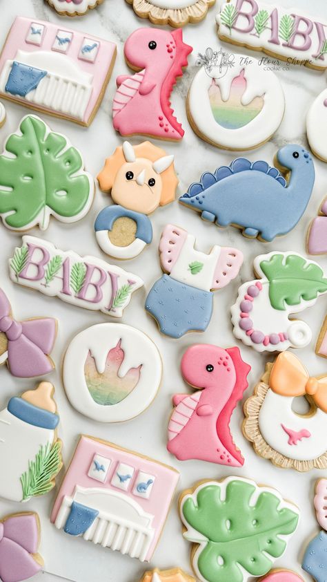 These dinosaur baby cookies are the cutest addition to your baby shower event.  Pastel rainbow with tropical leaves and bows were perfect for a baby girl dinosaur theme.  Royal Icing custom decorated sugar cookies by the Flour Shoppe Cookie Co in Omaha Nebraska. Watermelon Cookies, Royal Icing Sugar, Dinosaur Cookies, Girl Dinosaur, Dinosaur Baby Shower, Baby Cookies, Dino Party, Dinosaur Theme