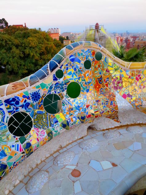 Rooftop benches with beautiful mosaic tile work at Antonio Gaudi's Parc Guell; Barcelona, Catalunya, Spain Antonio Gaudi Mosaic, Park Guell Barcelona Photos, Gaudi Mosaic Pattern, Park Guell Barcelona Gaudi Mosaic, Antoni Gaudi Mosaic, Gaudi Art Projects, Gaudi Tiles, Mosaic Barcelona, Gaudi Park Guell