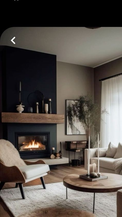 Black Fireplace With Taupe Walls, Black Wall Lounge, Front Sitting Room With Fireplace, Black Fireplace Ideas Paint, Black Fireplace Wall Wood Mantle, Black And Wood Interior Design Modern, Tan And Black House Interior, Dark Concrete Fireplace, Living Room With Black Fireplace Wall