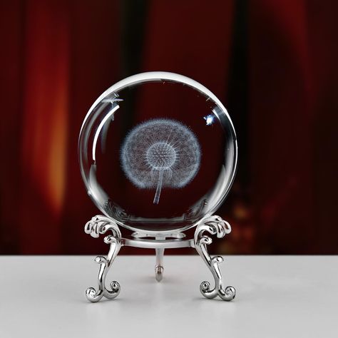 PRICES MAY VARY. 🌼Unique piece: 3D dandelion crystal ball with solid metal stand,meticulously crafted by our skilled craftsman, ensuring that each piece is a unique work of art. Size: 2.4 in(60mm) 🌼High quality crystal material and 3D laser engraving: Made of high-quality K9 crystal, the dandelion figurine printed on the crystal ball is carved using advanced 3D laser engraving technology. Even if used for a lifetime, crystals will not lose their original luster 🌼Warm gift: Use our dandelion p Dandelion Paperweight, The Dandelion, Crystal Paperweight, Skin Natural Remedies, Engraved Crystal, Decorations For Home, Graduation Gifts For Her, 3d Laser, Metal Stand