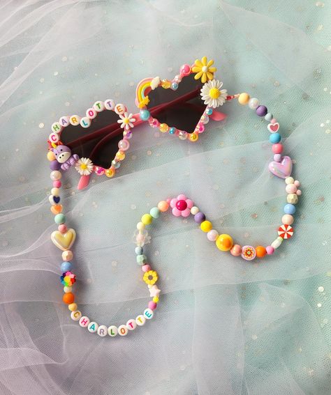 These chic Custom Mix Bead Sunglasses Chains are styled to express your child's vibrant and playful personality. They look fun and perfect to pair with our Personalized sunnies.These will also help your little ones keep their sunnies with them all day. No more forgetting your sunnies! Our sunny chains are each made by hand and of mixed colorful beads that will surely be unique to your child. All our designs are unique and have no duplicates. What you need to knowWARNING! CHOKING HAZARD! Contains Sunglasses Beaded Chain, Kids Bead Crafts, Sunglasses With Beads, Diy Kids Jewelry, Bracelets Diy Beads, Kids Crafts To Sell, Sunglasses Chains, Kids Jewelry Diy, Flower Hearts