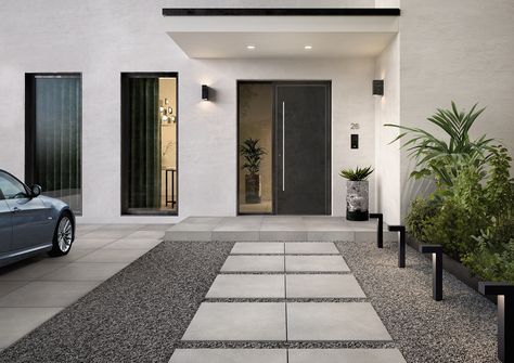 Keep it contemporary with Bernina porcelain tiles laid loosely in gravel leading up to your front door. More outdoor tile ideas for your pool, patio, and outdoor bar on our blog.