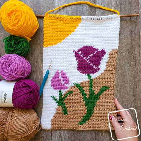 The Cute Tulips Wall Hanging Free Crochet Pattern by Divine Debris Crochet Banner, Cute Tulips, Wallhanging Patterns, Crochet Wall Hanging, Crochet Bird Patterns, Crochet Wall Art, Crochet Decor, Flower Tapestry, Crochet Birds