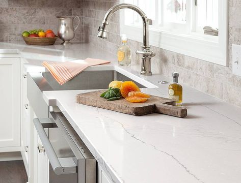 Subtle Marble veining, on a classic off white base.  Perfect for kitchens who want a touch of marble, for a fraction of the cost.  Pictured Here: Cambria Ella Quartz  Call for an estimate (813)602-7811 • • • #cambria #ella #quartz #quartzkitchen #dreamkitchen #homeinspo #decor #interiordesign #tampa #florida #countertops #marble #marblecountertops #marblekitchen #whitekitchen #homedecor #backsplash #tilebacksplash #subwaytile #instakitchen #sarasota #orlando #farmhousesink #stainlesssteel #mycam Cambria Quartz Countertops, Durable Countertops, Cambria Countertops, Outdoor Kitchen Countertops, Quartz Kitchen Countertops, Condo Kitchen, Quartz Kitchen, Countertop Design, Stone Kitchen