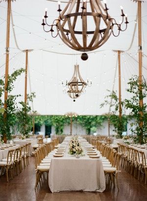 Not your average tented wedding – this sophisticated chic reception used rustic candle lit chandeliers to enhance the setting, which was surrounded by sparse greenery and neutral décor. Budget Wedding Venue, Charlottesville Virginia Wedding, Wedding Venues In Virginia, Ceremony Chairs, Virginia Wedding Venues, Charlottesville Wedding, Boda Mexicana, Wooden Chandelier, Summer Wedding Outdoor