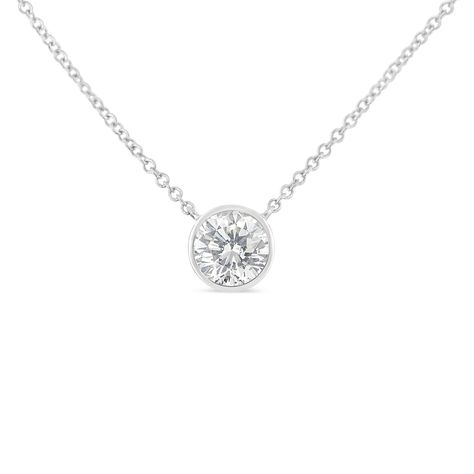 PRICES MAY VARY. A BRILLIANT CHOICE - A contemporary twist on a timeless classic, our petite 4mm-5mm pendant necklace features a single round brilliant-cut diamond stone of SI2-I1 clarity in your choice of carat weights, set in a simply elegant solitaire bezel setting. The adjustable cable chain is versatile: buy two necklaces in different sizes (and even metal colors!) and layer them at 16" & 18" inches for a trendy look. GENUINE QUALITY AND REAL VALUE - Haus of Brilliance offers sparkling natu Solitaire Diamond Necklace, Everyday Wear Jewelry, Diamond Solitaire Pendant, Solitaire Diamond Pendant, White Gold Pendant Necklace, Diamond Solitaire Necklace, Solitaire Pendant Necklace, Solitaire Necklaces, Bezel Set Diamond