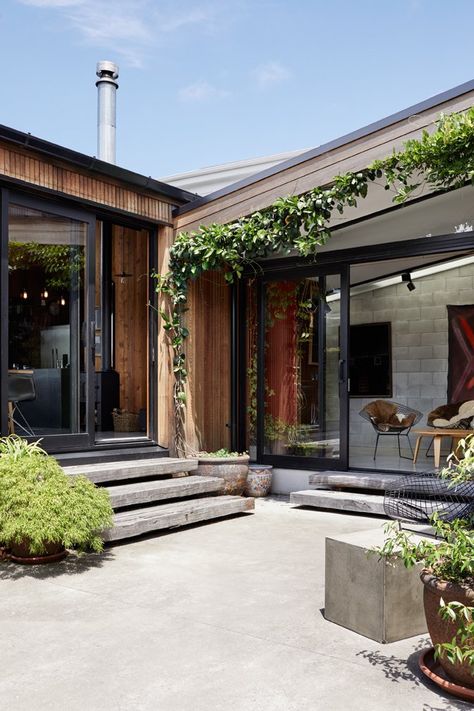 Outdoor, Concrete Patio, Porch, Deck, and Planters Patio, Porch, Deck Ample greenery in the courtyards softens the neutral material palette. Photo 6 of 19 in This New Zealand Architect Created a House That Looks Like a Tiny Village Concrete Courtyard Ideas, Concrete Wood Patio, Concrete Patio Landscaping Ideas, Concrete Courtyard, Entry Courtyard, Concrete Patio Ideas, Planters Patio, Village Photo, Porch Kits