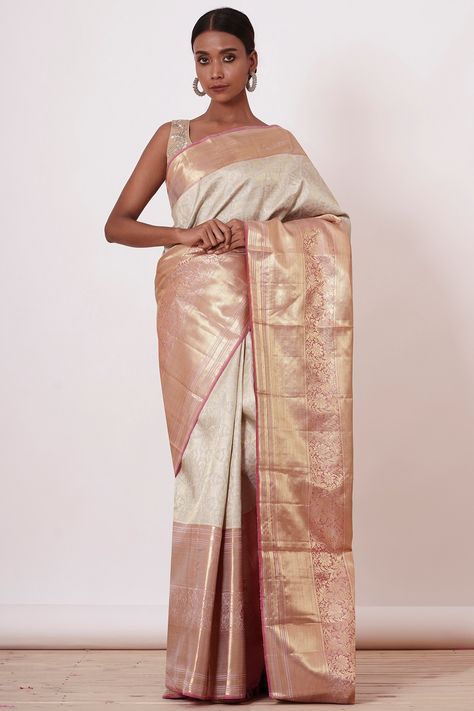 Featuring an ivory handwoven saree in pure dharmavaram silk base with a gold zari embroidered border. It is paired with a contrasting silver blouse.  FIT: True to size. COMPOSITION: Pure dharmavaram silk. CARE: Dry clean only. Indian White Wedding, White Wedding Saree, Indian Bridesmaid Dresses, Silver Blouse, Floral Saree, Saree For Women, Gold Blouse, Desi Clothes, Embroidered Border