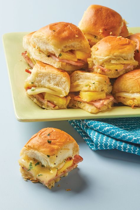 These Grilled Ham, Swiss, & Pineapple Sliders present a challenge:
try not to eat more than three of
these addictive, two-bite sandwiches
drenched in garlic butter at once! Pineapple Sliders, Ham And Pineapple, Grilled Ham, Sandwich Wraps, Dinner Side Dishes, Grilled Pineapple, Dinner Sides, Cheese Serving, Bacon Recipes