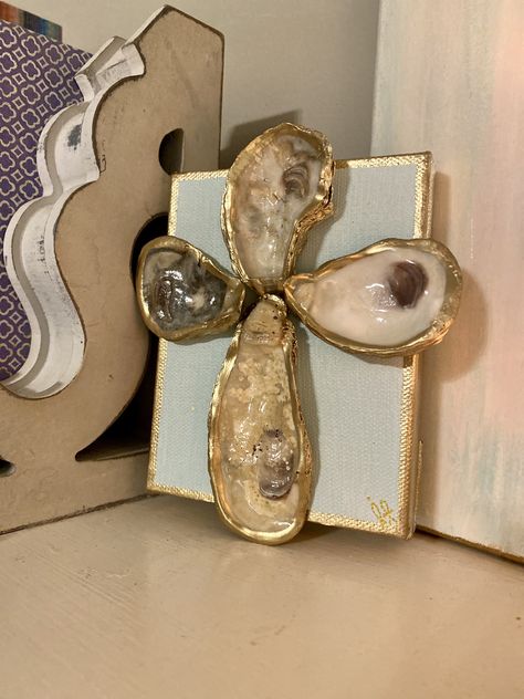 Excited to share this item from my #etsy shop: Oyster Cross #cross #handmade #goldpainting #oystercross #nativity #valentine #crossart #goldgild #bluepainting #seashellart #nursery #nurserydecor Oyster Christmas, Oyster Cross, Sea Glass Ornaments, Oyster Shells Diy, Christmas Shells, Beachy Christmas Tree, Shell Gifts, Oyster Crafts, Christmas Ornaments Diy Kids