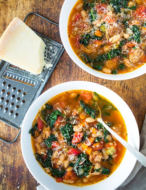 Tuscan Sausage and Kale Stew - http://tuttorossotomatoes.com/recipes/detail/tuscan-sausage-and-kale-stew Tuscan Sausage, Tuscan Soup With Sausage, Tuscan Bean Soup With Sausage, Italian Sausage And Kale Soup, Italian Sausage Kale Tortellini Soup, Tuscan Kale Sausage Soup, Sausage And Kale Soup, Sausage Tortellini Soup, Sausage Stew