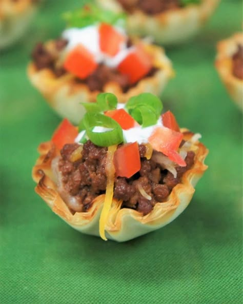 These little taco cups make a great appetizer and they’re really easy to make too. These flaky and delicious fillo cups are filled with flavorful taco meat, then baked and topped with cheddar jack cheese. #tacocups #appetizers Philo Cups Appetizers Appetizer Recipes, Philo Cups, Mini Taco Appetizer, Philo Dough, Taco Appetizers, Lasagna Cups, 4th Of July Fun, New Year's Snacks, Dessert Nachos