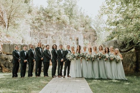 The Quarry is a Venue in Knoxville, TN located on an abandoned Marble Quarry. Photo by T & K Photography. Florals by LBFloral. Rentals by AOPR.   | Navy Suits | Canyon | Veil | Rock Wall | Bow Ties | Sage Bridesmaid dresses | Blush accents | Groomsmen | Sage Bow Tie Groomsmen, Sage Green Bridesmaid Dresses Groomsmen, Sage Green And Black Bridal Party, Sage Green Bridesmaid Dresses And Groomsmen, Sage Green Bow Tie Groomsmen, Sage Wedding Party Groomsmen, Sage Green Wedding Party Attire, Navy Suit Sage Tie, Sage Green Bridesmaid And Groomsmen