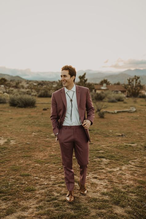 Bright + Boho Wanderlust Inpso in Joshua Tree | Desert Wedding | Modern Wedding Inspiration | Desert Wedding Inspiration | Mauve Red Southwestern Groomsmen Attire | Stylish Groom | #aandbebridalshop #ruedeseine #joshuatreewedding Earth Tones Suit Men, Groom Suit Casual Wedding, Semi Formal Rustic Wedding Guest Attire, Mens Boho Wedding Attire Guest, Groom Attire Boots, Mountain Wedding Mens Attire, Desert Groom Attire, Desert Wedding Guest Outfit Men, Desert Wedding Suit