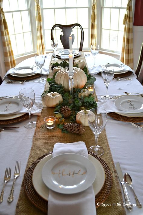 Burlap Runner and White Pumpkins for Thanksgiving Centerpiece - Simple but Elegant Thanksgiving Table.  #tablesettings #thanksgiving #Thanksgivingtable #falltable #centerpieces #whitepumpkins Dinner Table Diy, Thanksgiving Table Settings Elegant, Modern Thanksgiving Table, Diy Thanksgiving Centerpieces, Elegant Thanksgiving Table, Thanksgiving Dinner Table Decorations, Tablescapes Autumn, Simple Thanksgiving Table, Burlap Runner