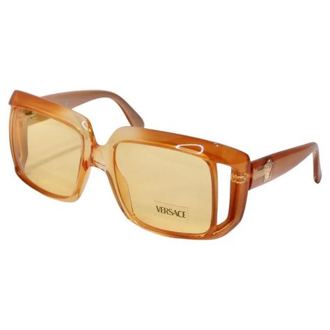 How stunning are these Versace dead stock sunglasses circa 1990s?! The perfect square frame sunglasses in a vibrant and stunning gradient orange color-way. These are the perfect every day sunglasses with a vibrant flare! Match these to a multicolor Pucci dress and pair with a Moschino handbag for a playful and laid back look. Never been worn, new dead stock sunglasses in perfect condition, please see photos. Made in Italy. 90s Glasses, Glasses Fashion Eyewear, Glasses Frames Trendy, Pucci Dress, Orange Sunglasses, Square Frame Sunglasses, Stylish Glasses, Versace Sunglasses, Color Naranja