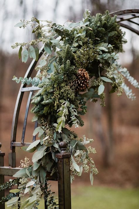 Wedding Arch Ideas Winter, Evergreen Garland Wedding Arch, Forest Wedding Arches, Pine Arch Wedding, Evergreen Arch Wedding, Eucalyptus And Evergreen Wedding, Christmas Wedding Arbor Ideas, Christmas Arbor Wedding, December Wedding Arch