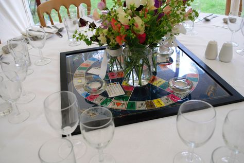 board game centerpieces | Table Decorations Board Game Table Wedding, Board Game Table At Wedding, Board Game Wedding Centerpieces, Game Wedding Centerpieces, Wedding Board Games, Boardgame Centerpieces Wedding Reception, Board Games Wedding, Board Game Wedding Seating Chart, Game Centerpieces