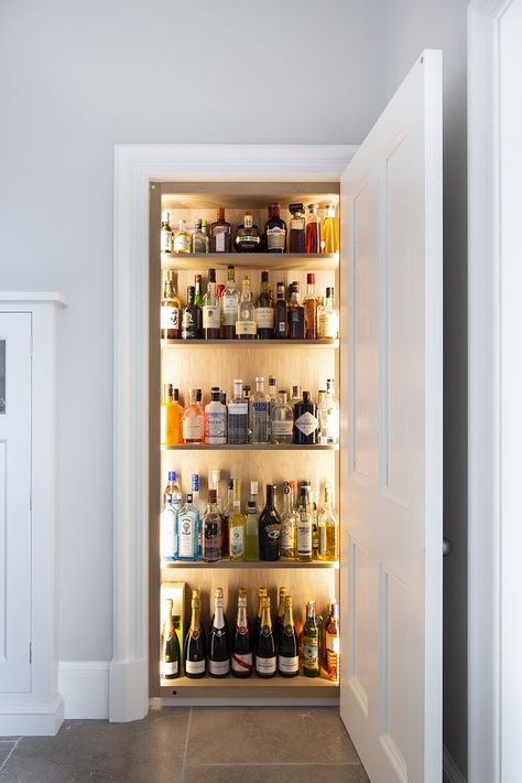 Bespoke kitchen by Laurence McIntosh. Edinburgh press converted in to a luxury drinks cabinet with integrated LED lighting. Edinburgh Press Ideas, Cocktail Cupboard Drinks Cabinet, Drinks Cupboard Ideas, Edinburgh Press Cupboard Ideas, Edinburgh Flat Interior, Bar Cabinet Lighting, Understairs Bar, Alcohol Cupboard, Alcohol Cabinet Ideas