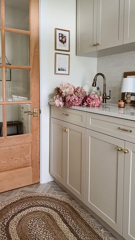 38K views · 6.7K reactions | Laundry / Mudroom Details: Flooring: tribeca Sand 2” x 10” @centuratile Backsplash: Mallorca White Glossy 3″ × 8″ @centuratile Cabinet Colour: Natural Cream @benjaminmoore Faucet @deltafaucetcan Rug @rugs_usa Pantry Door: from A1 doors. Currently unstained ☺️ | Amy E Peters | Home Decor | Father John Misty · Real Love Baby Cream Colored Kitchen Cabinets, Mudroom Paint Color, Father John Misty, Cream Kitchen Cabinets, Greige Kitchen, Florida Kitchen, Laundry Mudroom, Earthy Home Decor, Laundry Room Flooring