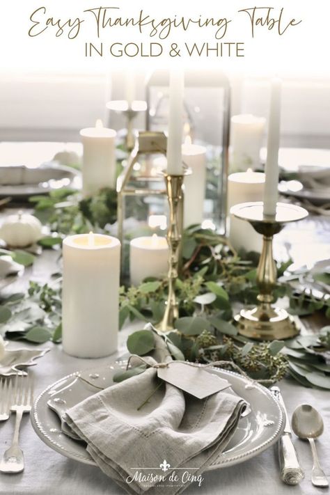 Easy & Elegant Neutral Thanksgiving Tablescape! Elegant Tablescape with brass lanterns, white pumpkins, and lots of greenery --->#maisondecinq falltable falltablescape falltablesetting autumntable autumntablescape thanksgivingtable thanksgivingtablescape #tablesetting tablescape thanksgivingentertaining thanksgivingdecor falldecor fallentertaining entertainingideas White And Gold Thanksgiving Table, White Thanksgiving Tablescapes, Elegant Thanksgiving Tablescapes, Elegant Thanksgiving Table Setting Ideas, Gold Thanksgiving Table, Thanksgiving Table Settings Elegant, Thanksgiving Table Setting Ideas, Thanksgiving Table Settings Simple, Thanksgiving Table Setting