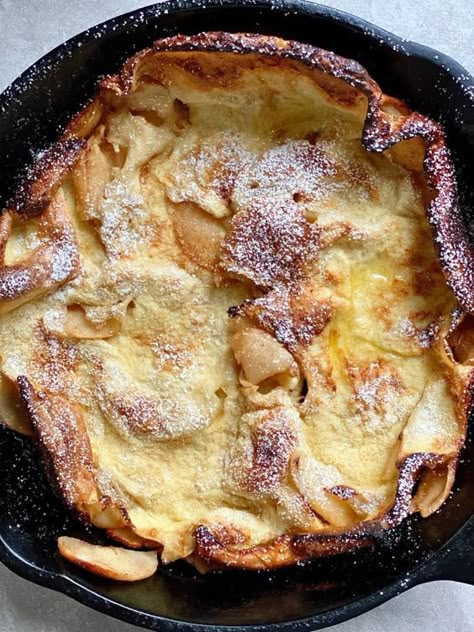 fluffy light german pancake in cast iron skillet with browned edges and curly ends Apple Cinnamon Dutch Baby, Dutch Apple Pancake, German Apple Pancake Recipe, Baked Apple Pancake, Hearty Winter Recipes, Easy Weekend Breakfast, German Apple Pancake, Apple Pancake Recipe, Dutch Baby Pancakes