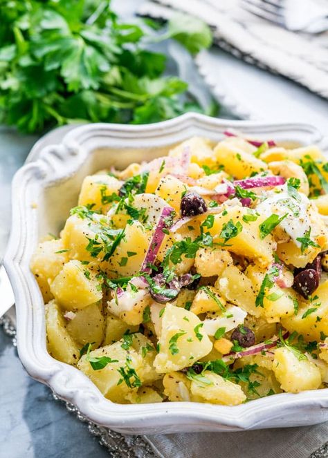 Romanian Potato Salad with olives, eggs and red onions! An easy, delicious and hearty potato salad ready in only 30 minutes! #potatosalad Egg Olive Salad Recipe, Croatian Potato Salad, Romanian Recipes, Romanian Appetizers, Slovenian Potato Salad, Romanian Potato Salad, Romanian Cabbage Salad, Zoe’s Kitchen Potato Salad, Potato Salad With Apples