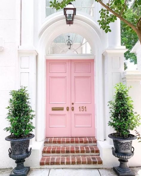 Make your front door stand out each season with a fresh coat of paint. We're loving this front door paint color called "Nancy's Blushes" by Farrow & Ball. We've got more front door paint color ideas for you in this post. Bright Front Doors, Best Front Door Colors, Pink Front Door, Best Front Doors, Front Door Paint Colors, Door Paint Colors, Sherwin Williams Colors, Charleston Homes, Pink Door