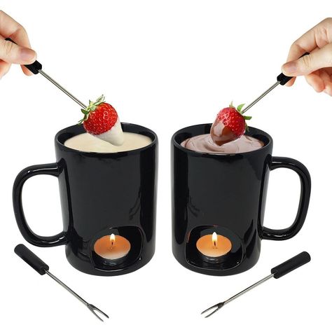 Easy fondue at home! With this personal fondue mug set by Kovot, melt cheese or chocolate for dipping fruit, veggies, breads and more. Ceramic personal fondue mugs feature bottom openings for tea lights (not included) to heat your favorite dip. Set of 2 fondue mugs and 4 dipping forks. In order for the tea light to burn most efficiently, make sure there is air flow (I.e. fan/window) so that the flame does not suffocate. Microwave and dishwasher safe. Black mugs measure 3"L x 5"W x 4 3/4"H. Forks are 4 5/8"L . Fondue At Home, Chocolate For Dipping, Easy Fondue, Chocolate Deserts, Pretzel Dip, Favorite Dips, Fondue Set, Black Mugs, Fruit Dip